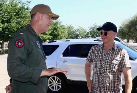 Actor and musician Gary Sinise is welcomed to the local navy base by Base Commander Shawn O'Connor.